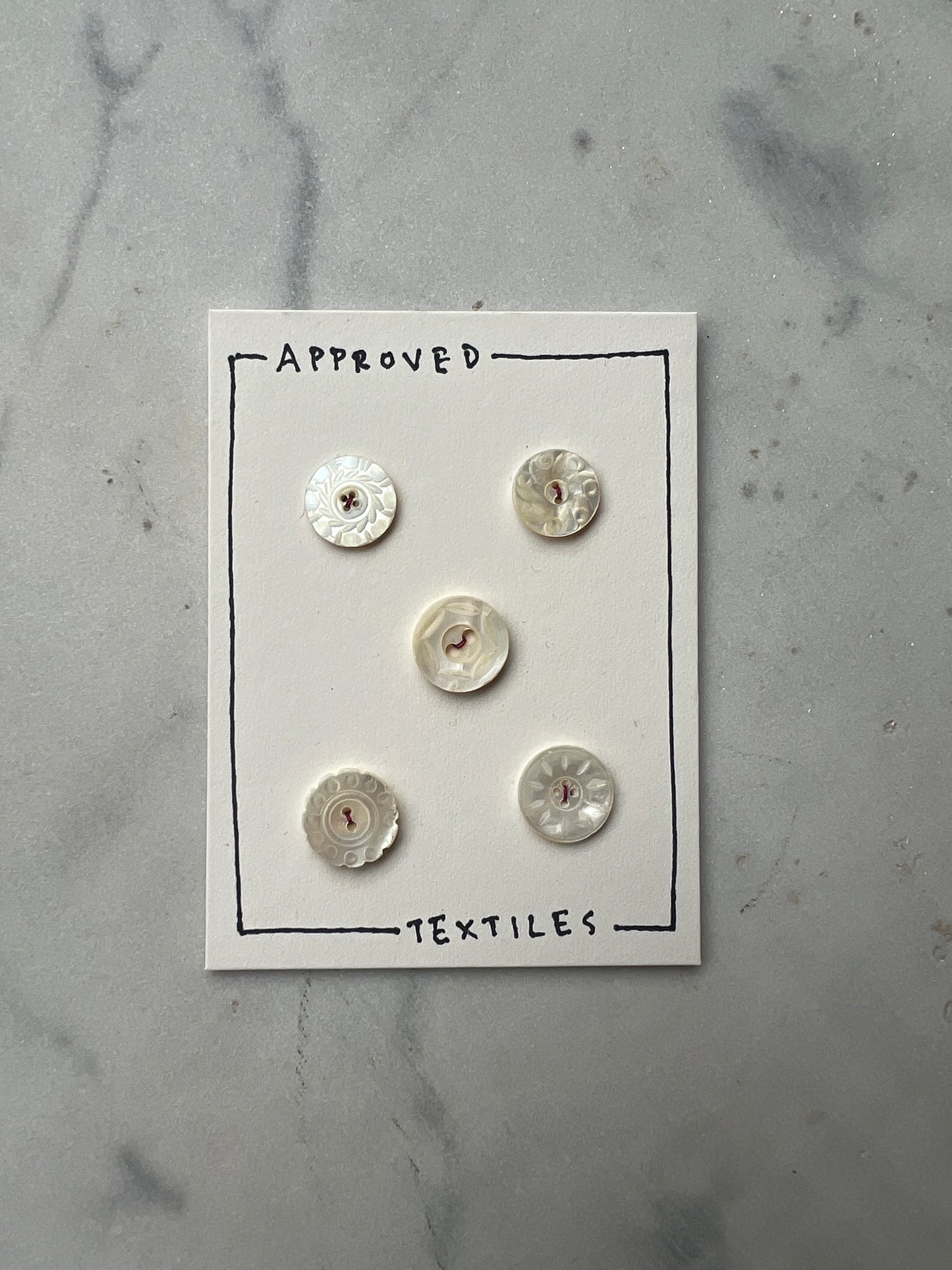 carved pearl buttons