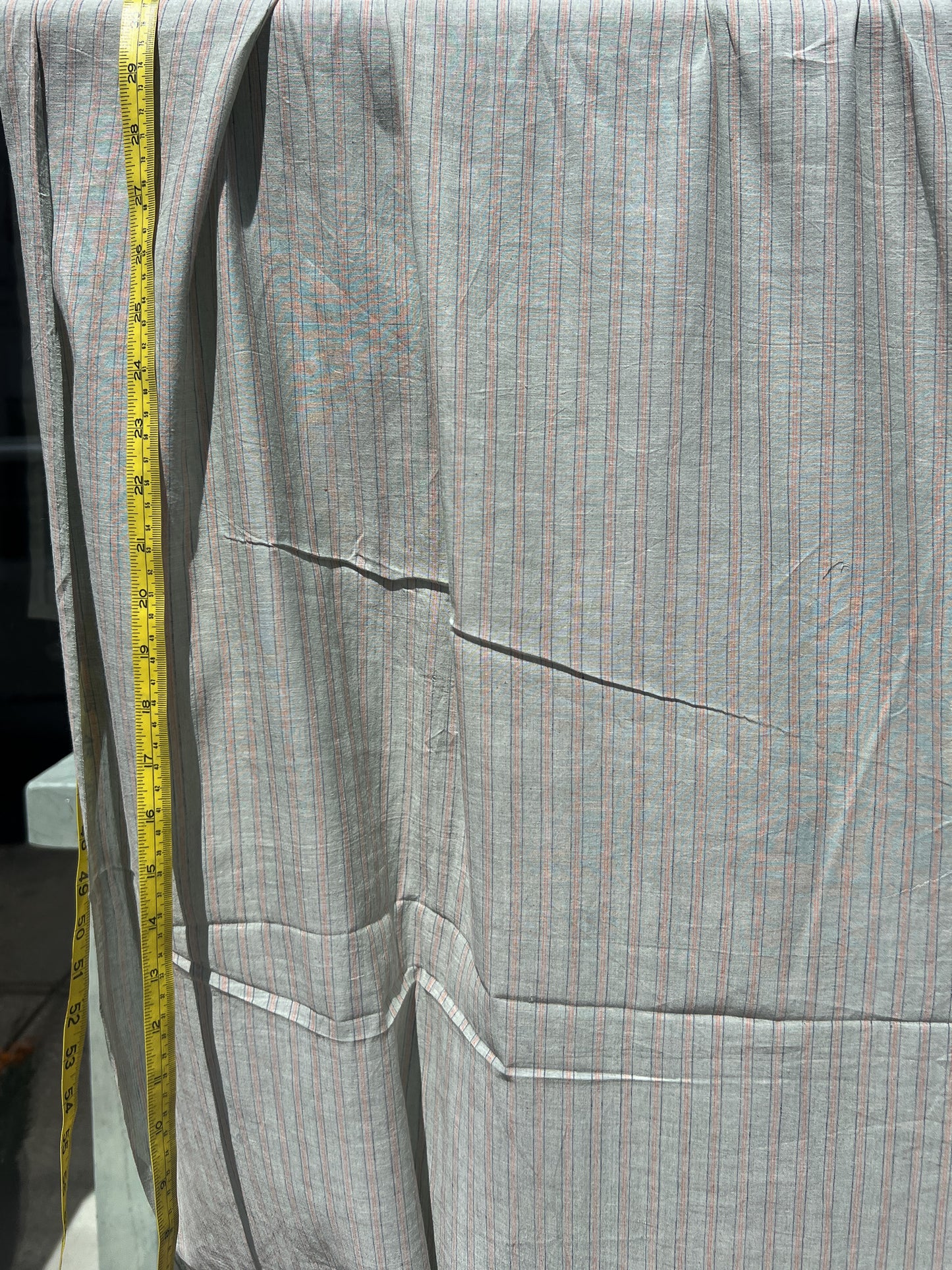 green cotton with blue and orange pinstripe