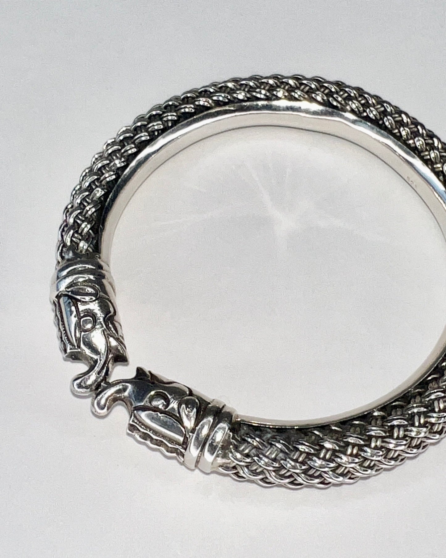 braided silver bracelet with elephant closure