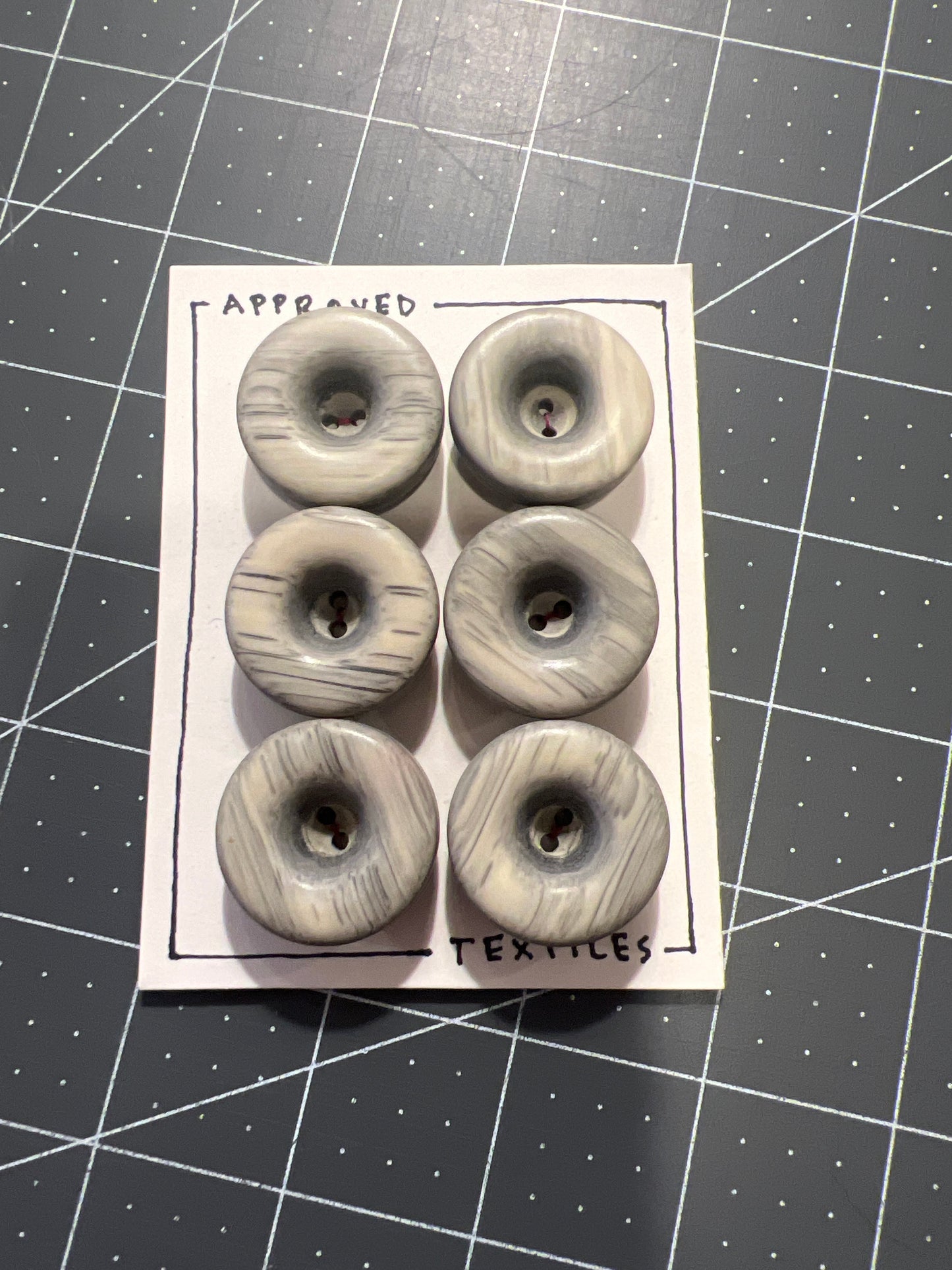 large wood or horn buttons