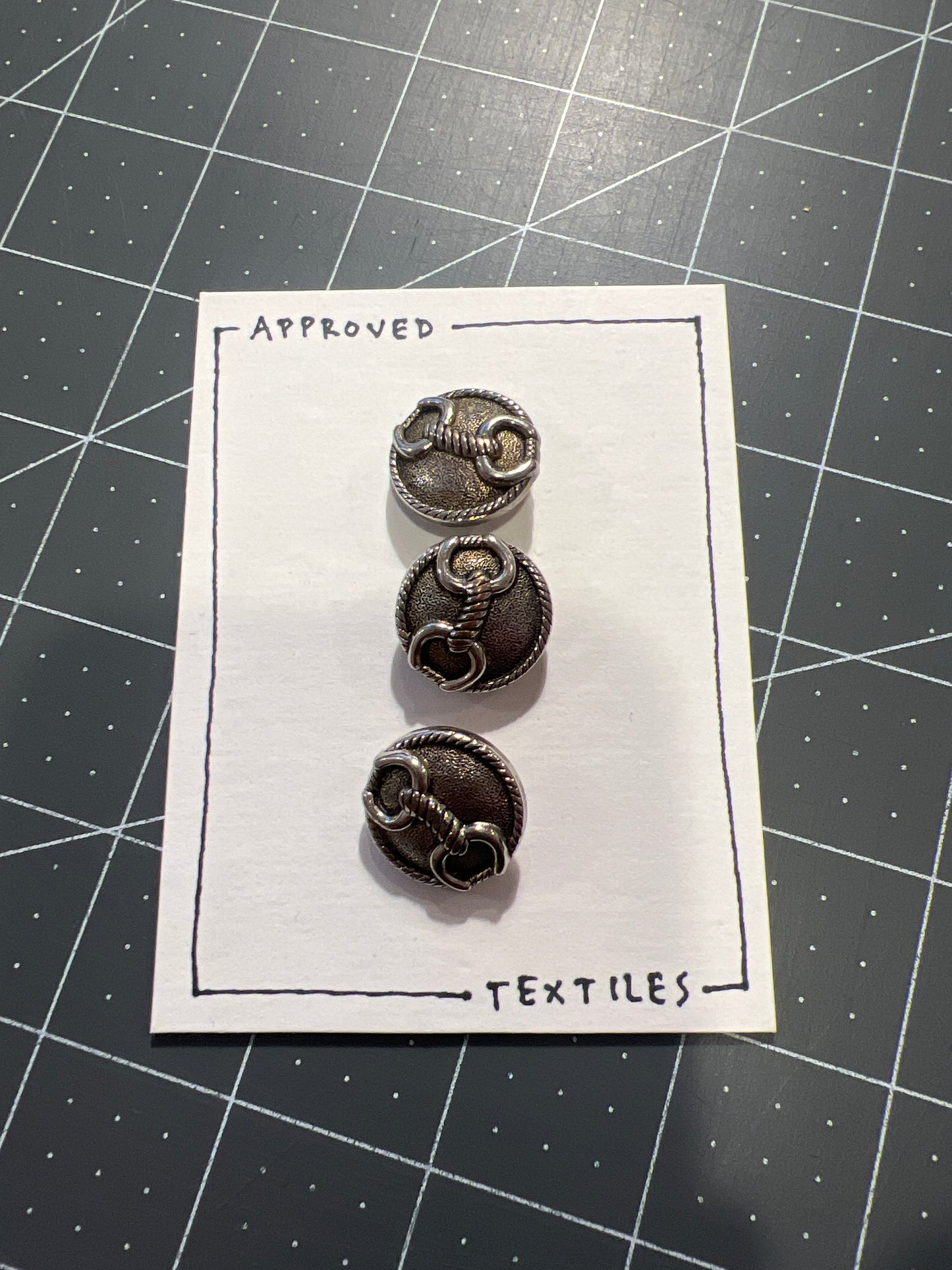 silver metal horse bit buttons