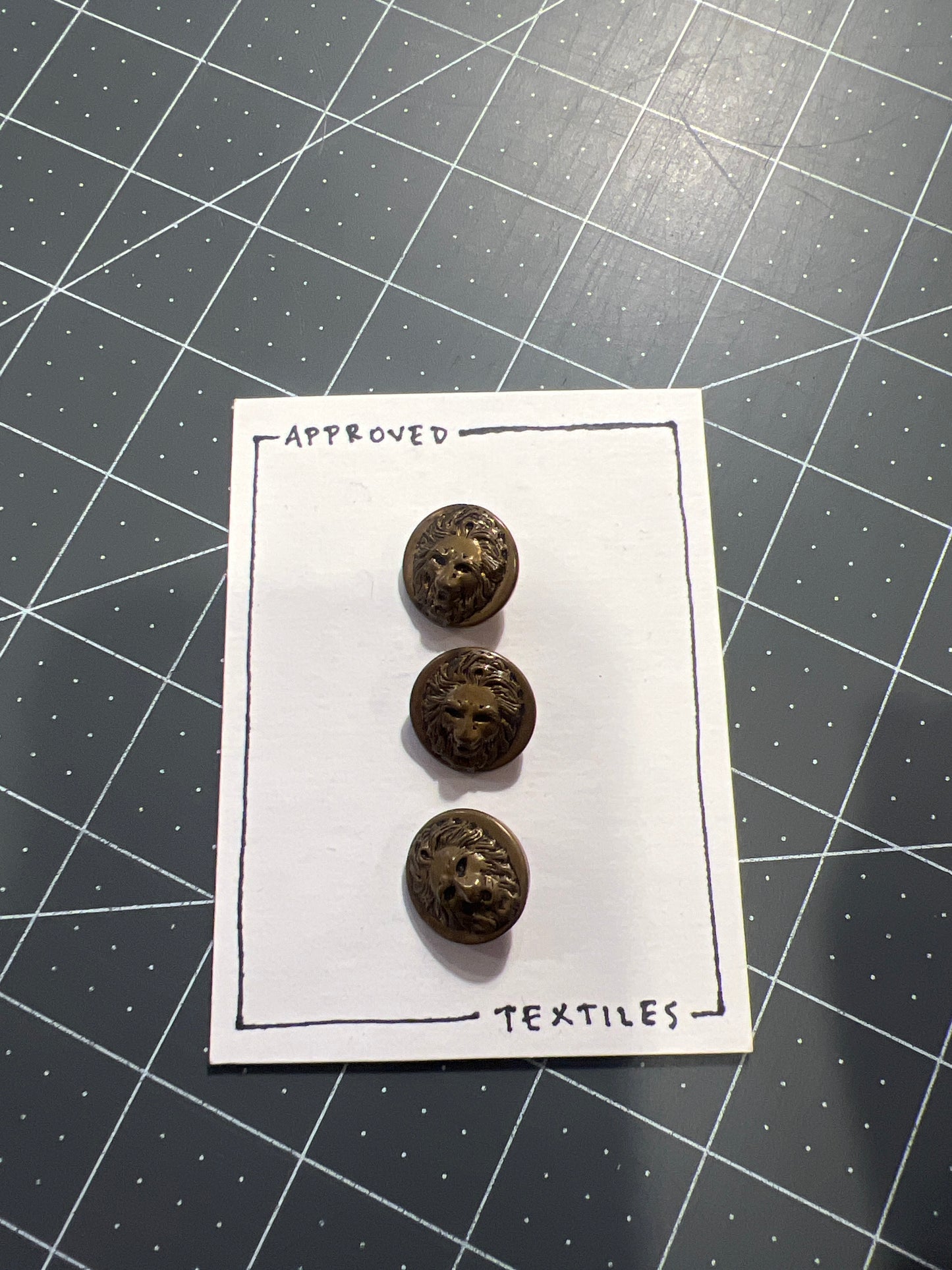 bronze lions head buttons