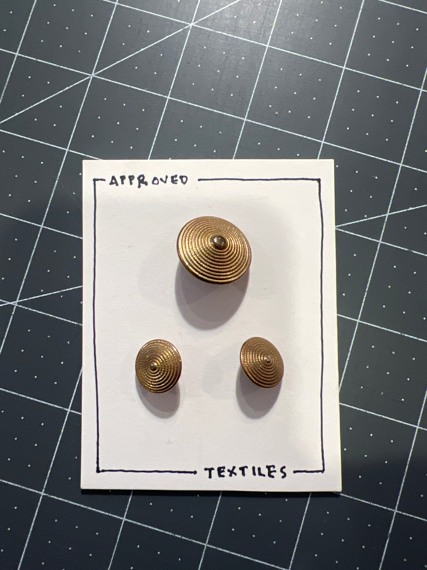 brass stepped circle buttons