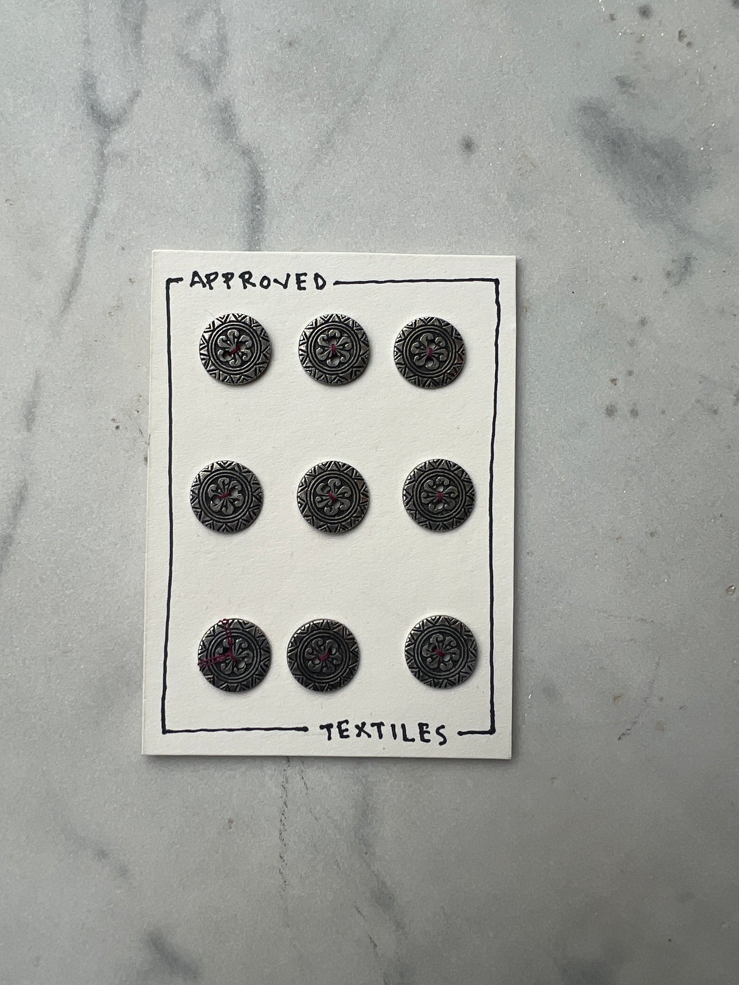 little silver geometric buttons