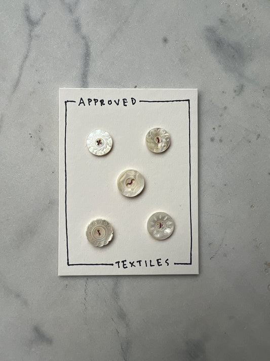 carved pearl buttons
