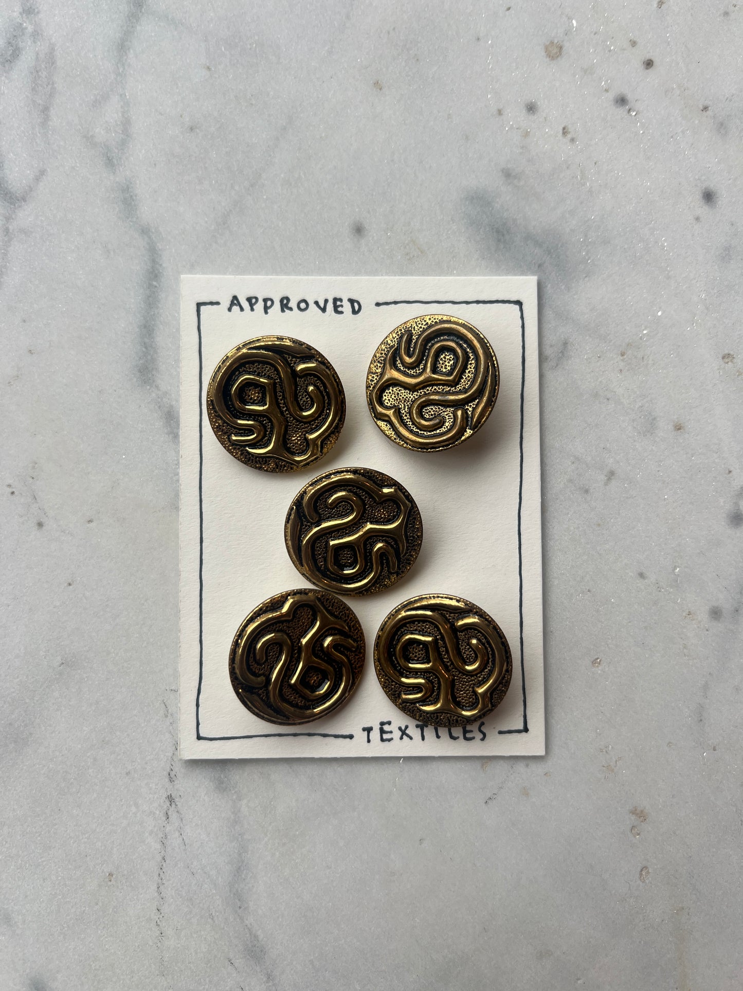 brass sculptural coat buttons