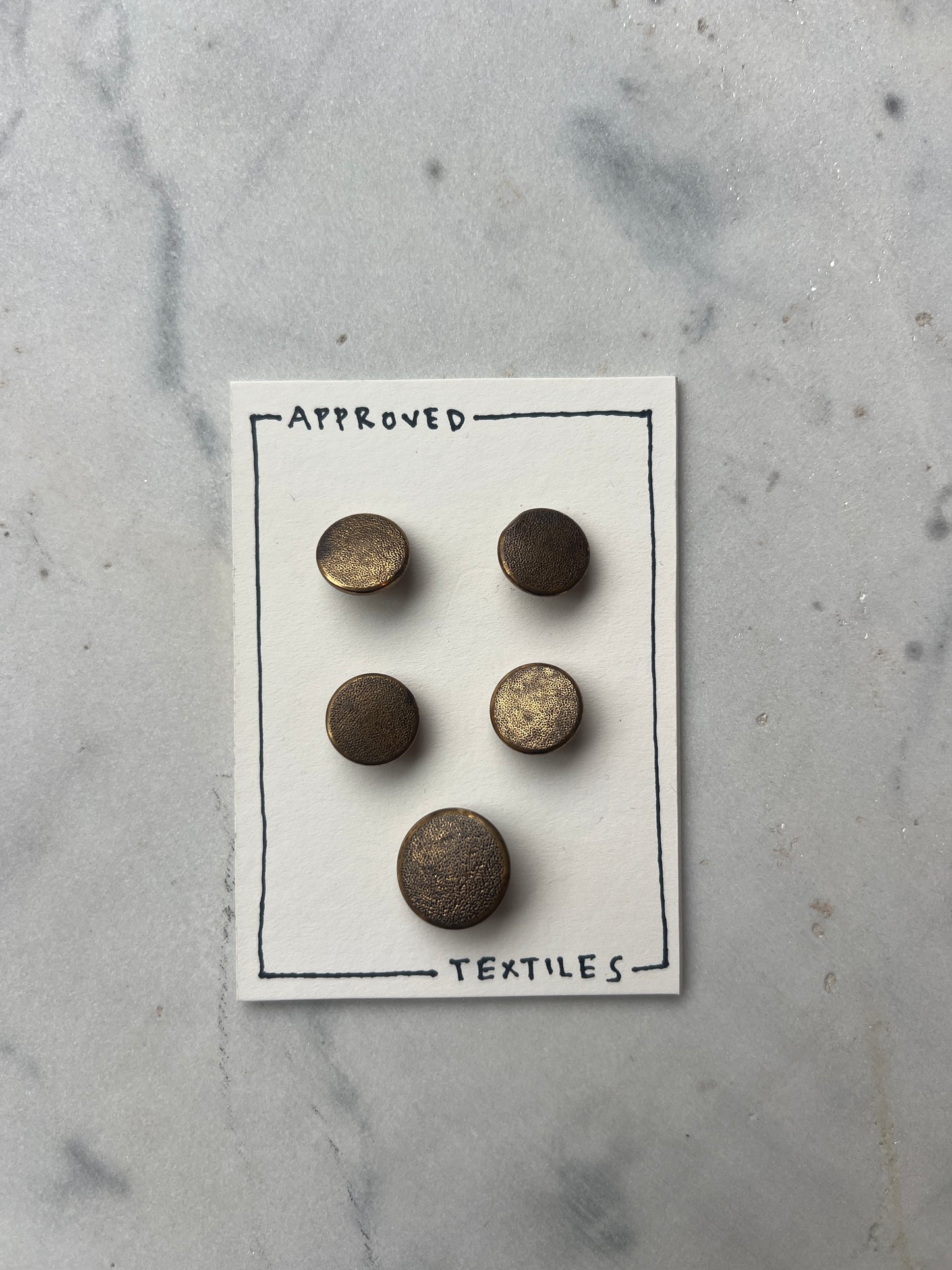 textured brass buttons