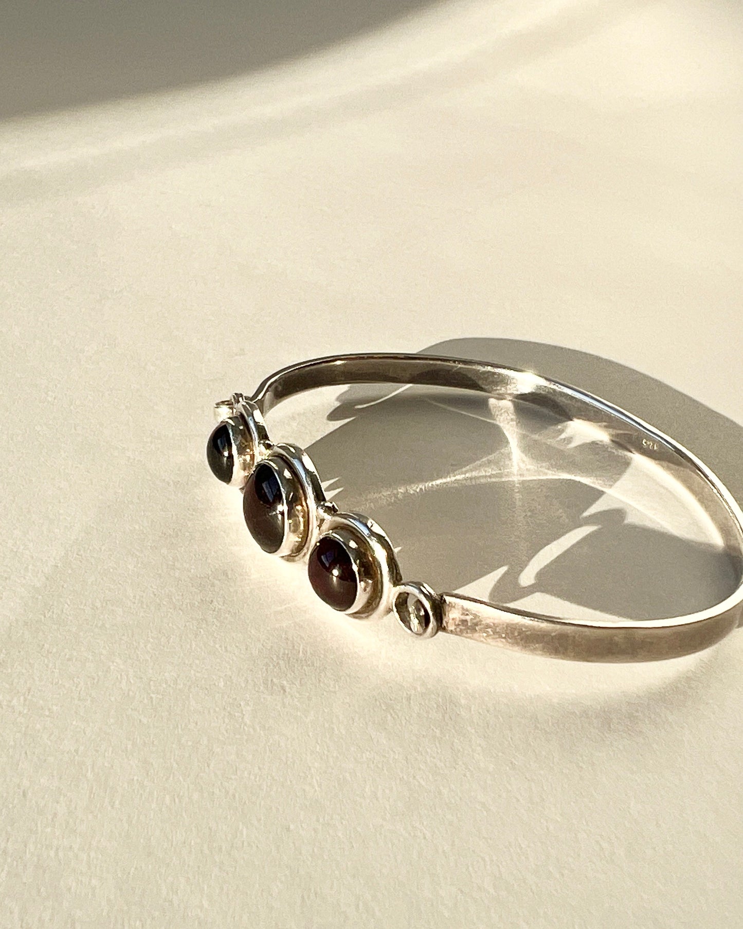 hinged silver bracelet with garnets
