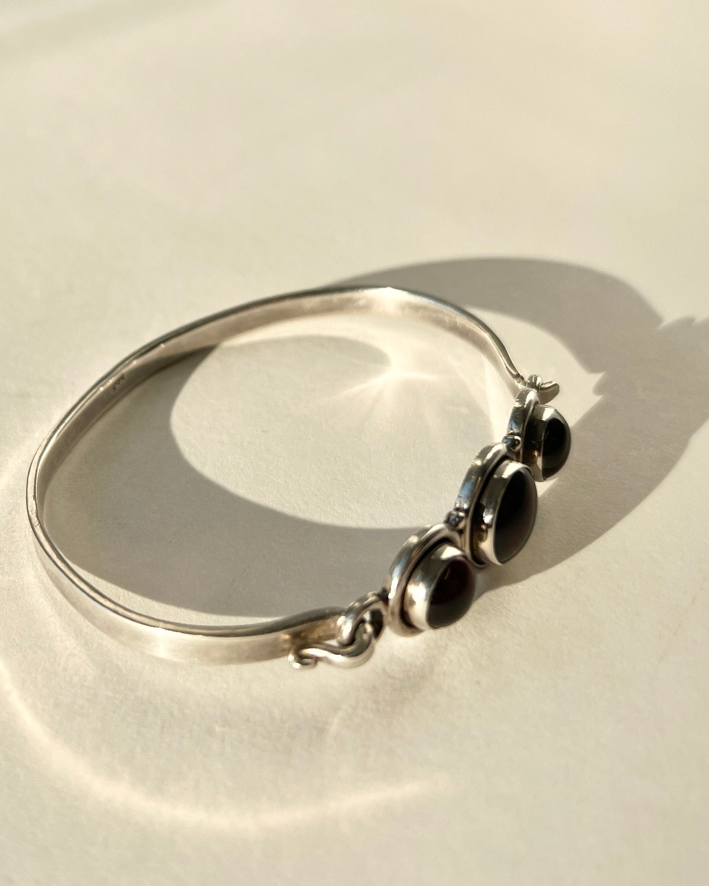 hinged silver bracelet with garnets