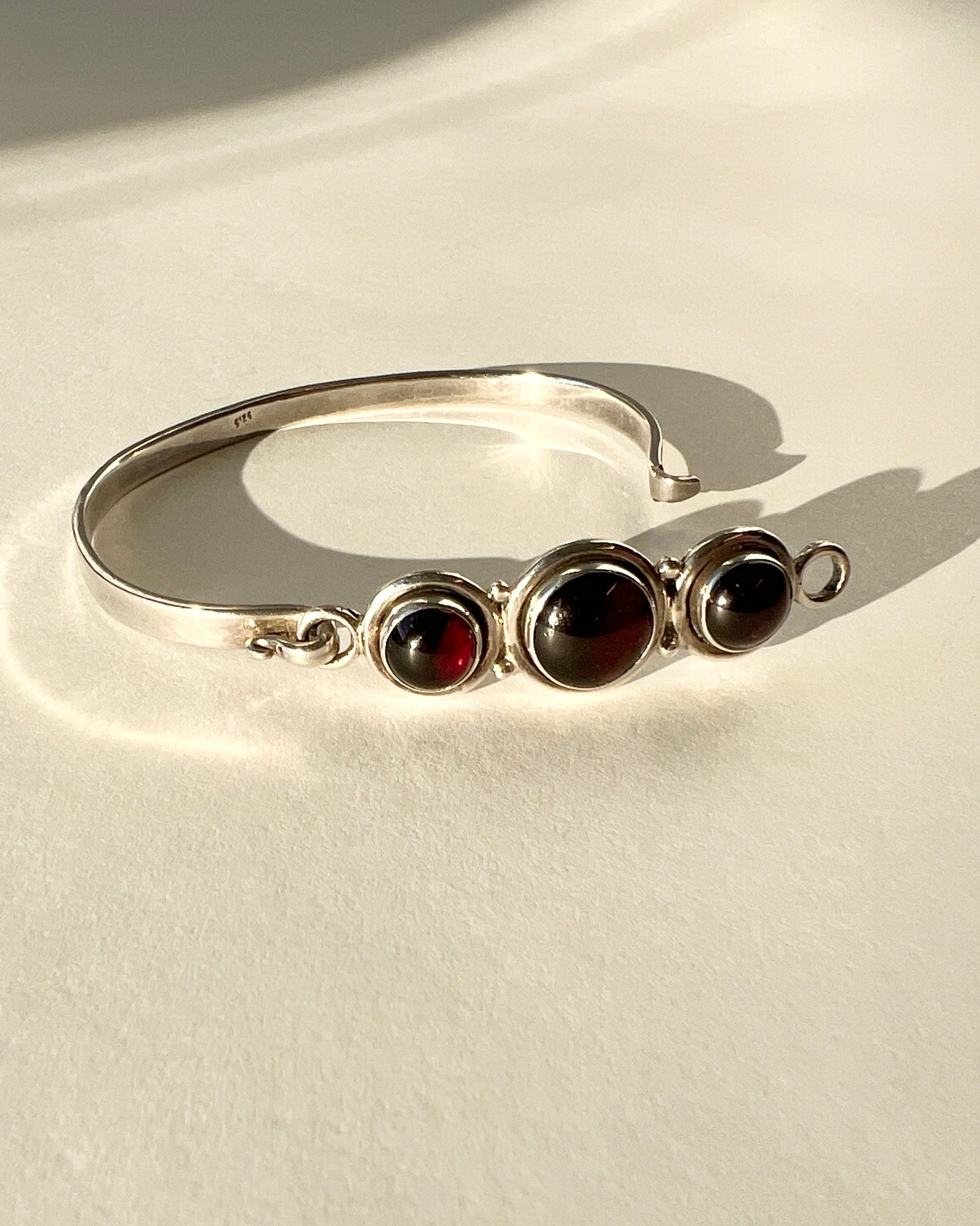 hinged silver bracelet with garnets