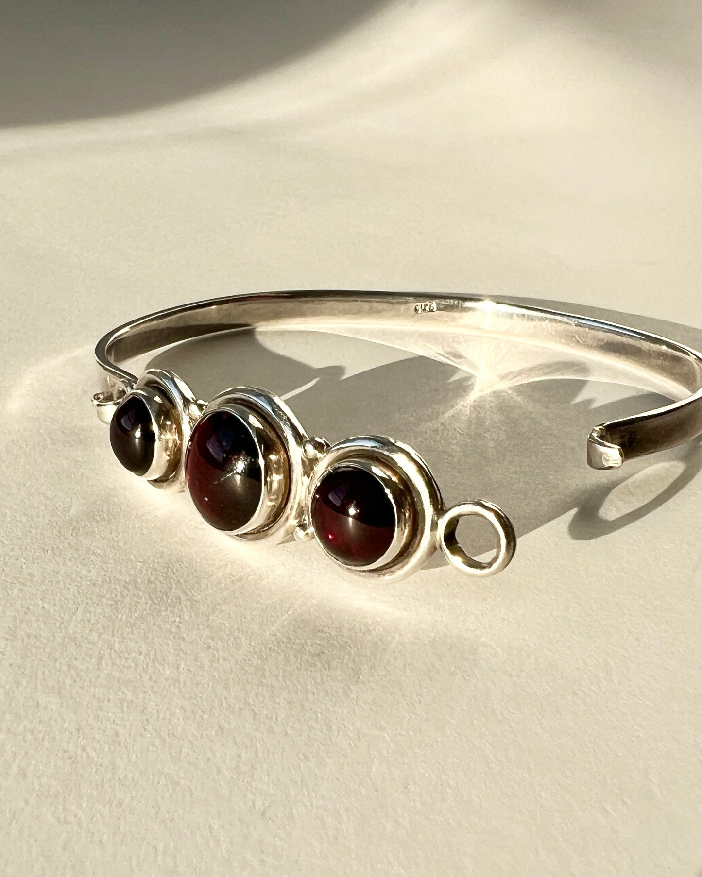 hinged silver bracelet with garnets