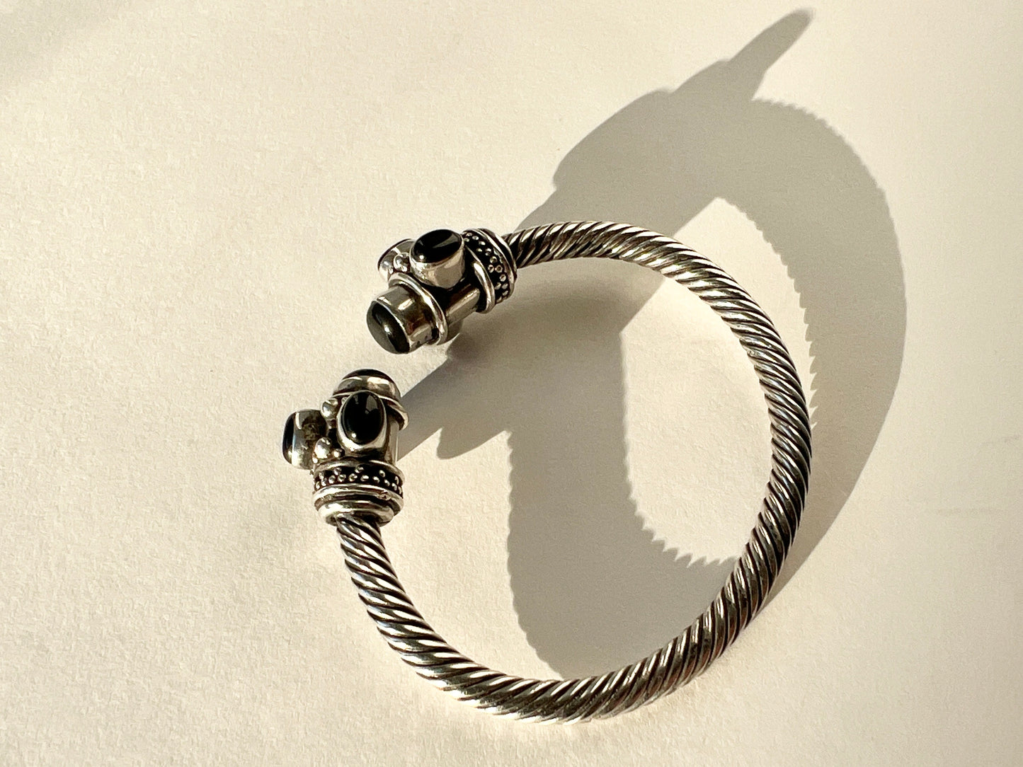 twisted silver bracelet with onyx cabochons