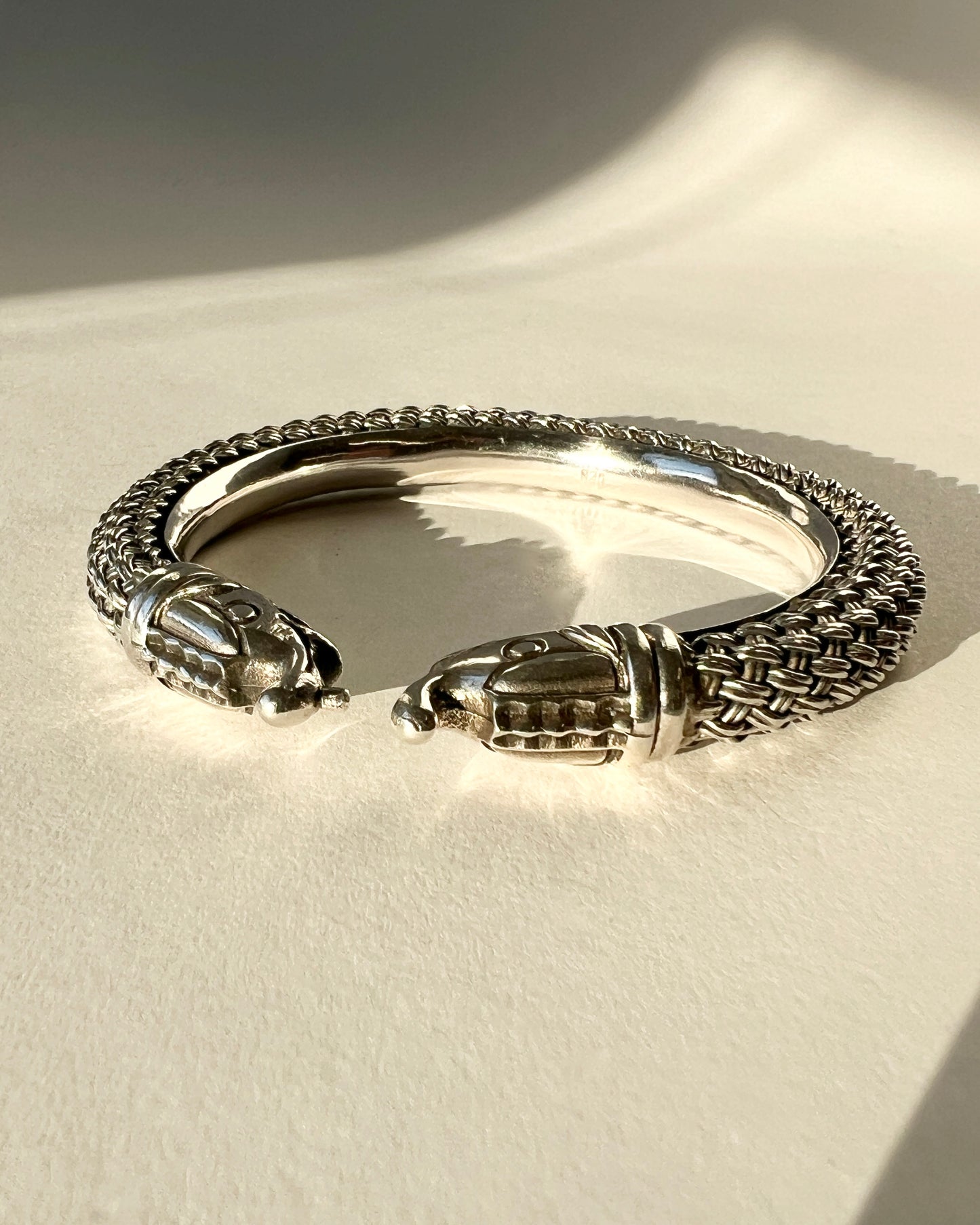 braided silver bracelet with elephant closure