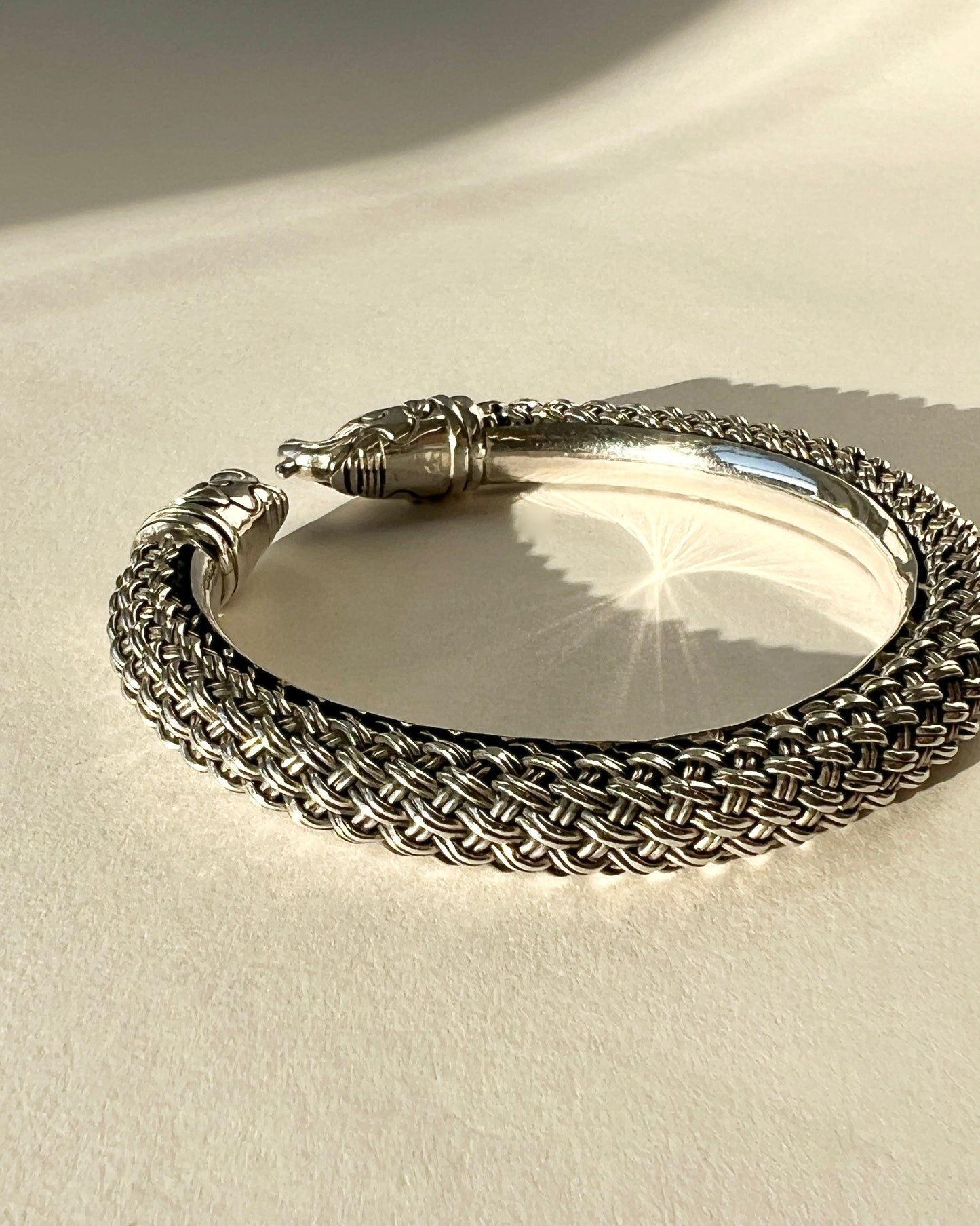 braided silver bracelet with elephant closure