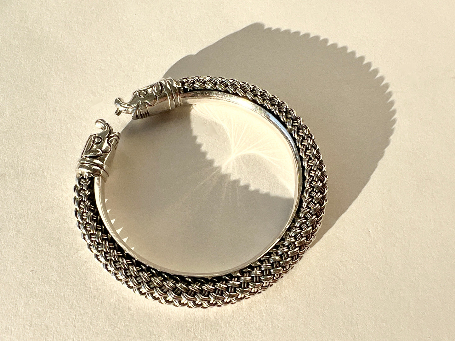 braided silver bracelet with elephant closure