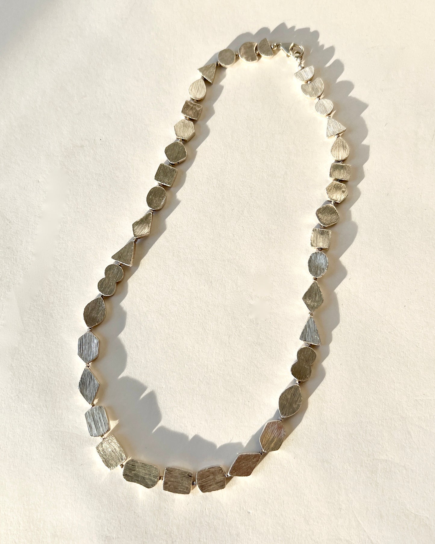 brushed silver shapes necklace