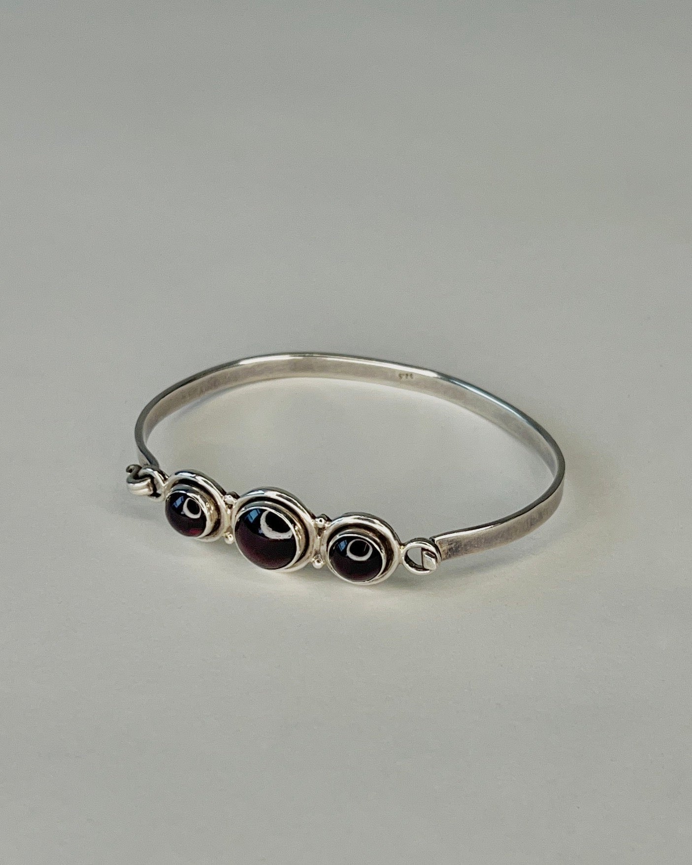 hinged silver bracelet with garnets