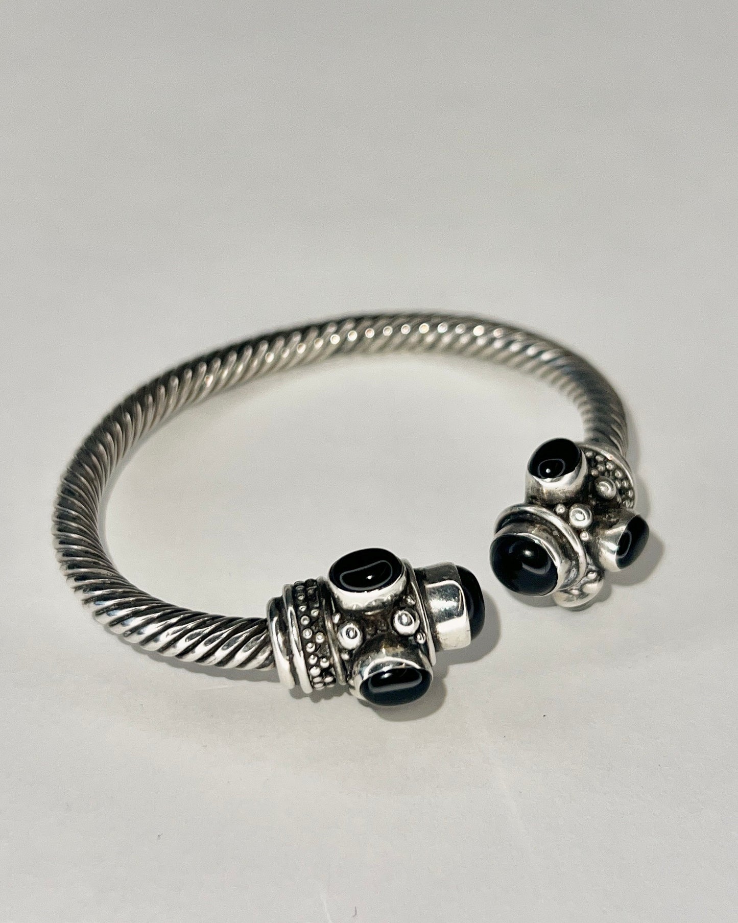 twisted silver bracelet with onyx cabochons