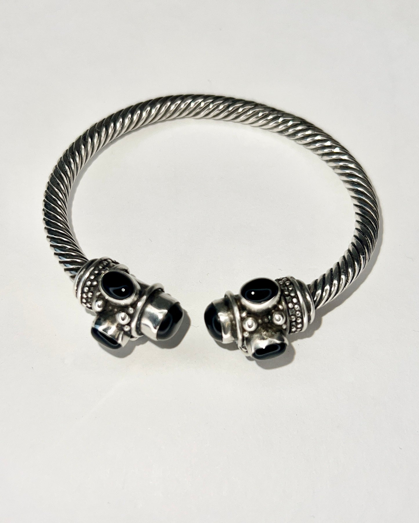 twisted silver bracelet with onyx cabochons