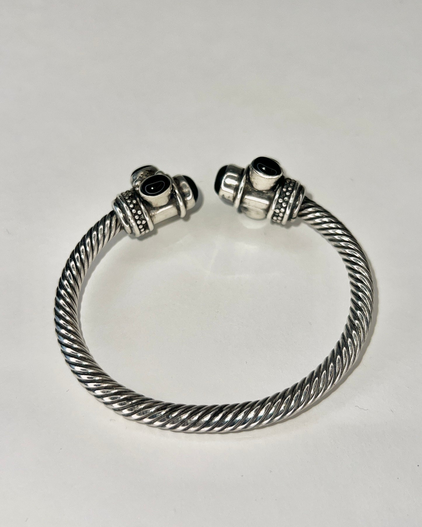 twisted silver bracelet with onyx cabochons