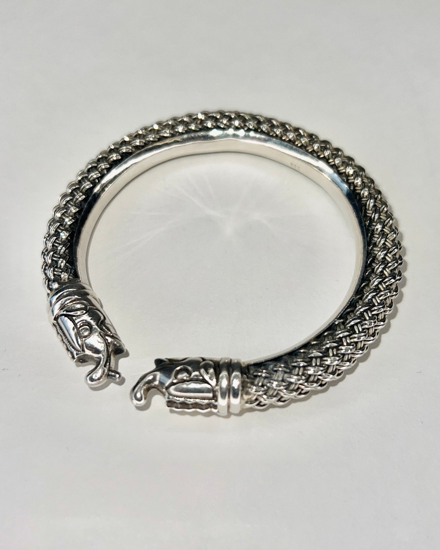 braided silver bracelet with elephant closure