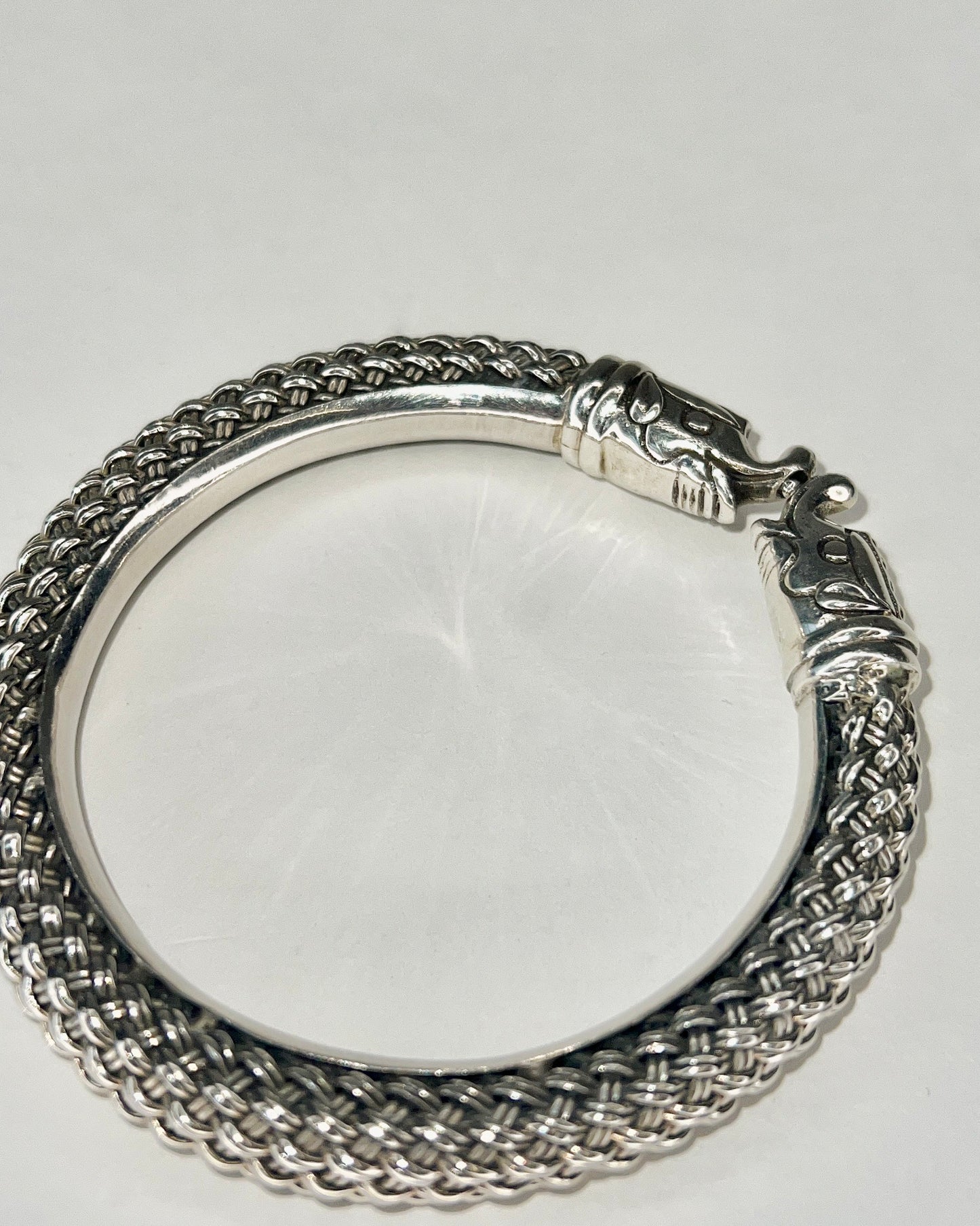 braided silver bracelet with elephant closure