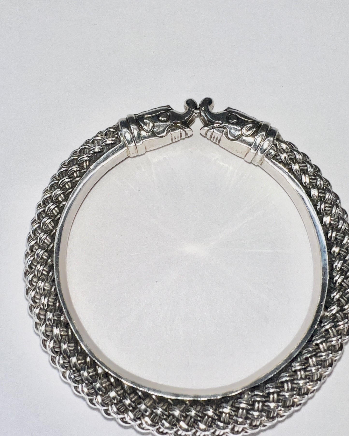 braided silver bracelet with elephant closure