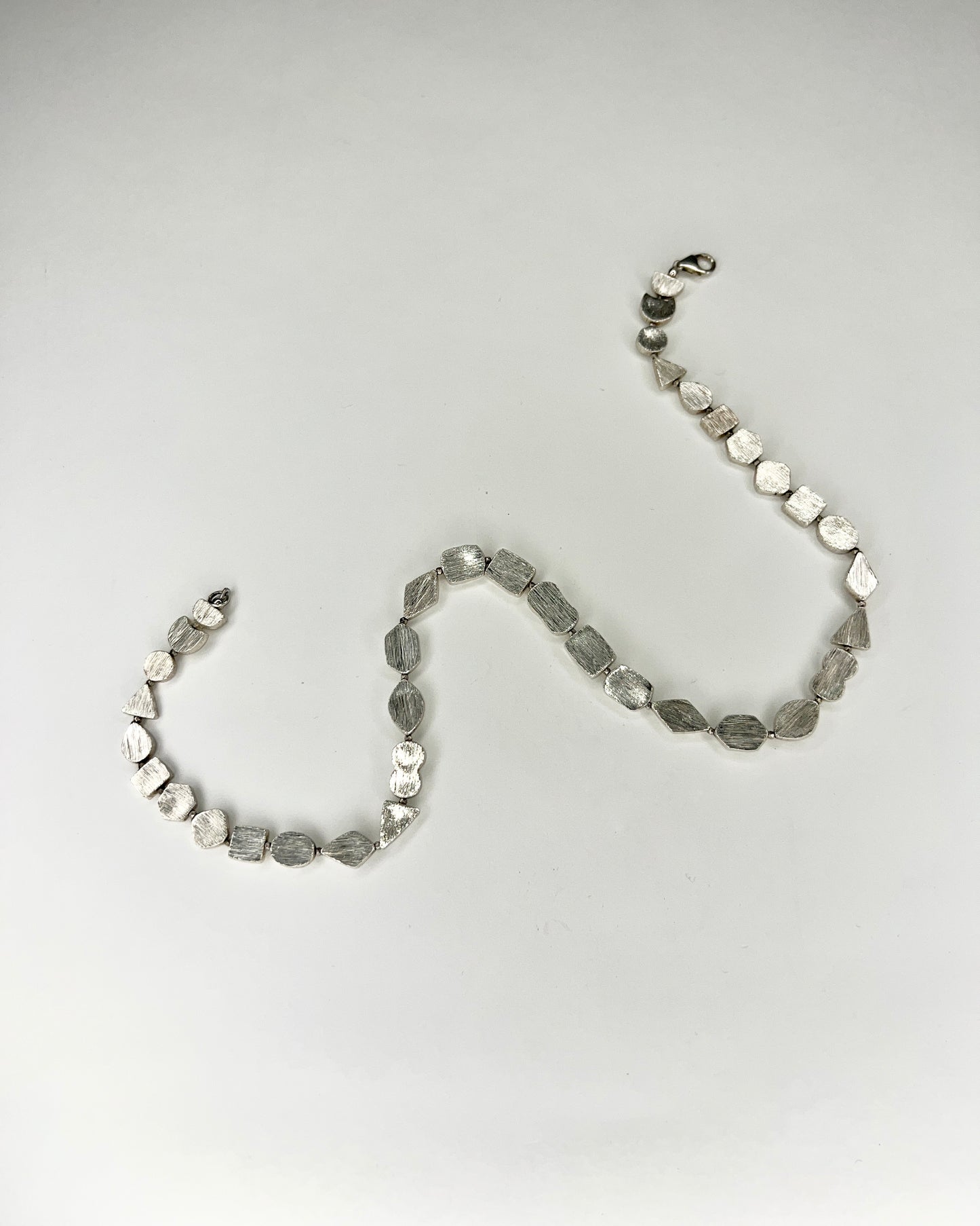 brushed silver shapes necklace